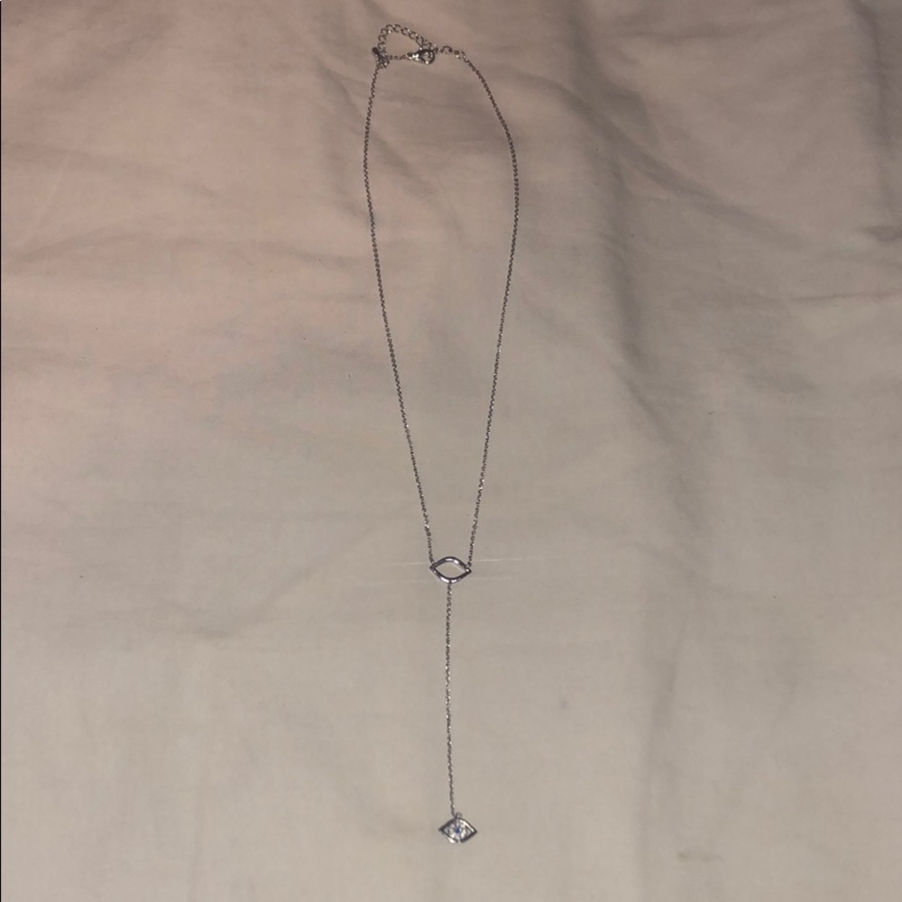 Silver lariat necklace with evil eye